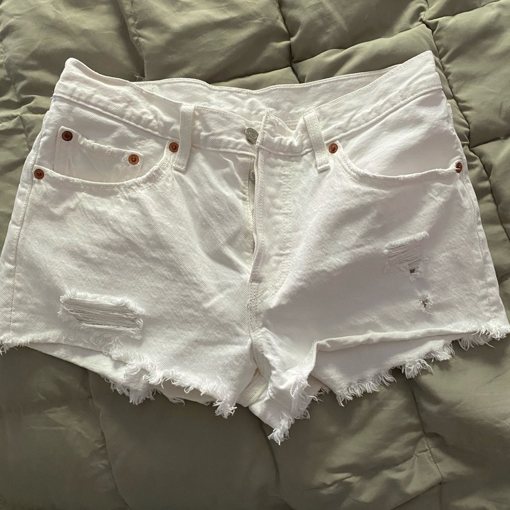 White ripped shorts